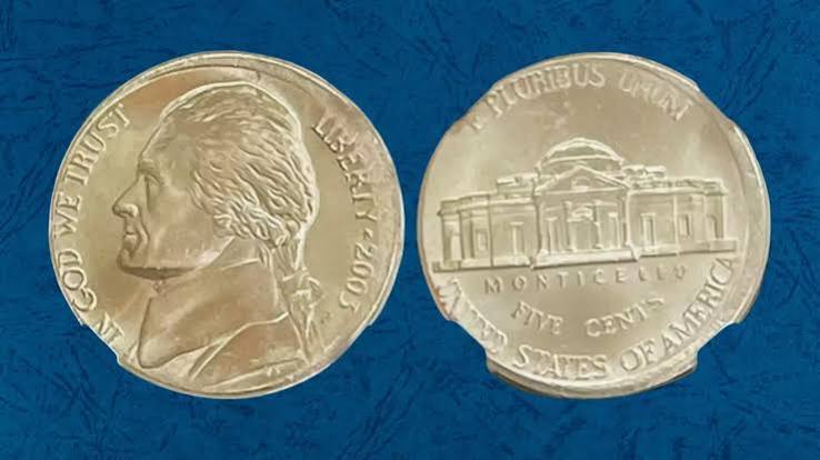 2003 Jefferson nickel off-center strike error with partial design and visible blank area, date still legible